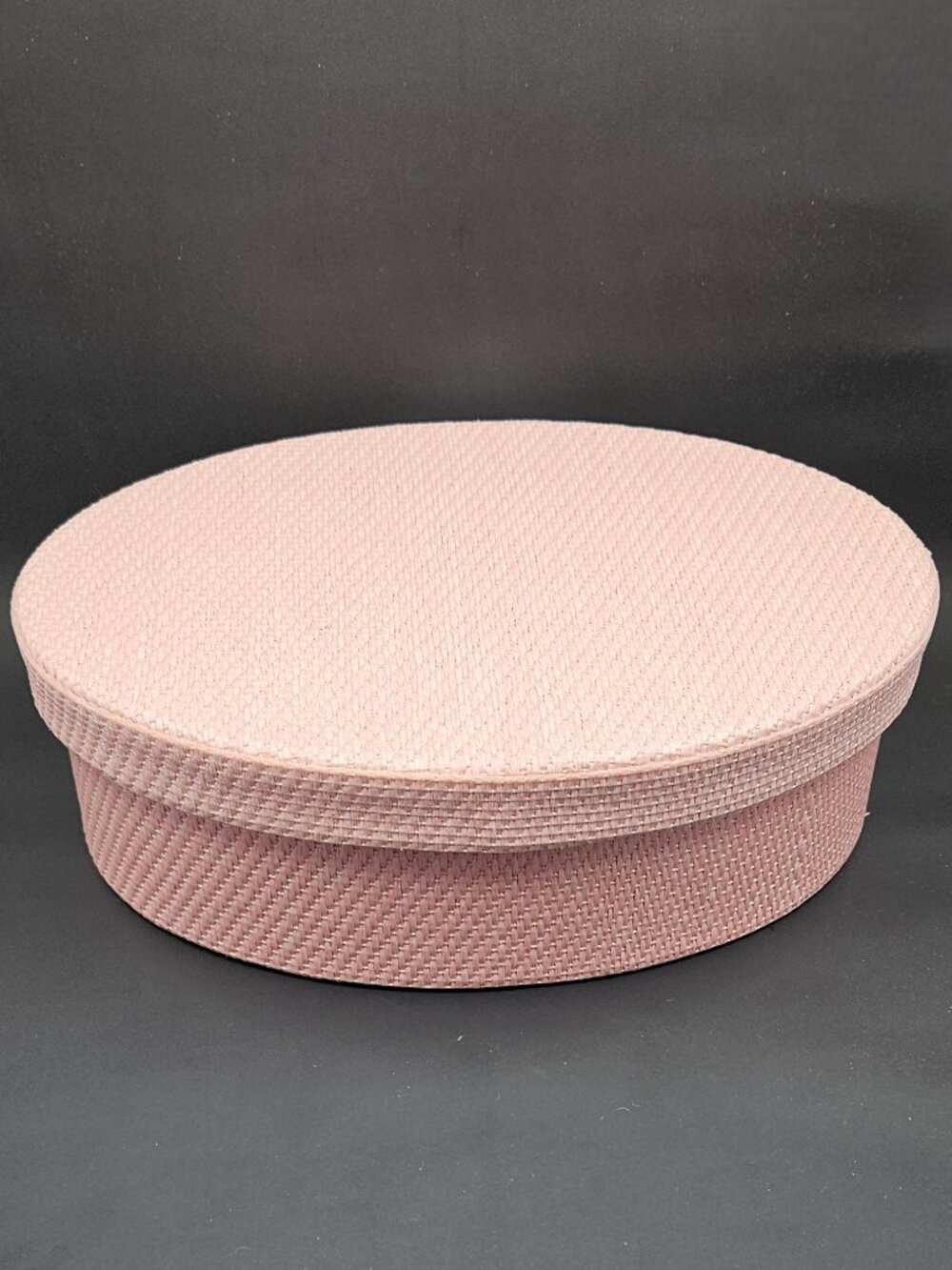 Estee Lauder straw-covered pink oval box